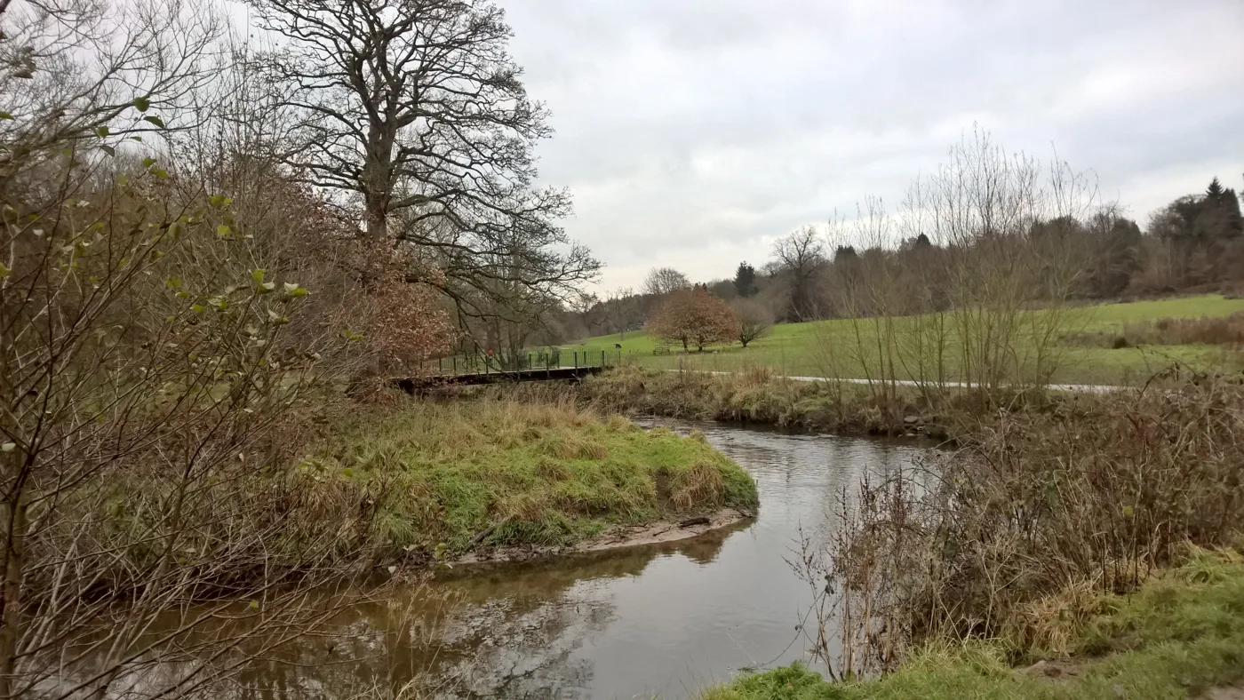 The River Bollin winding through the Carrs in Wilmslow, the one park in Cheshire East with its own dog order. The photo was taken in 2017 and does not show enforcement