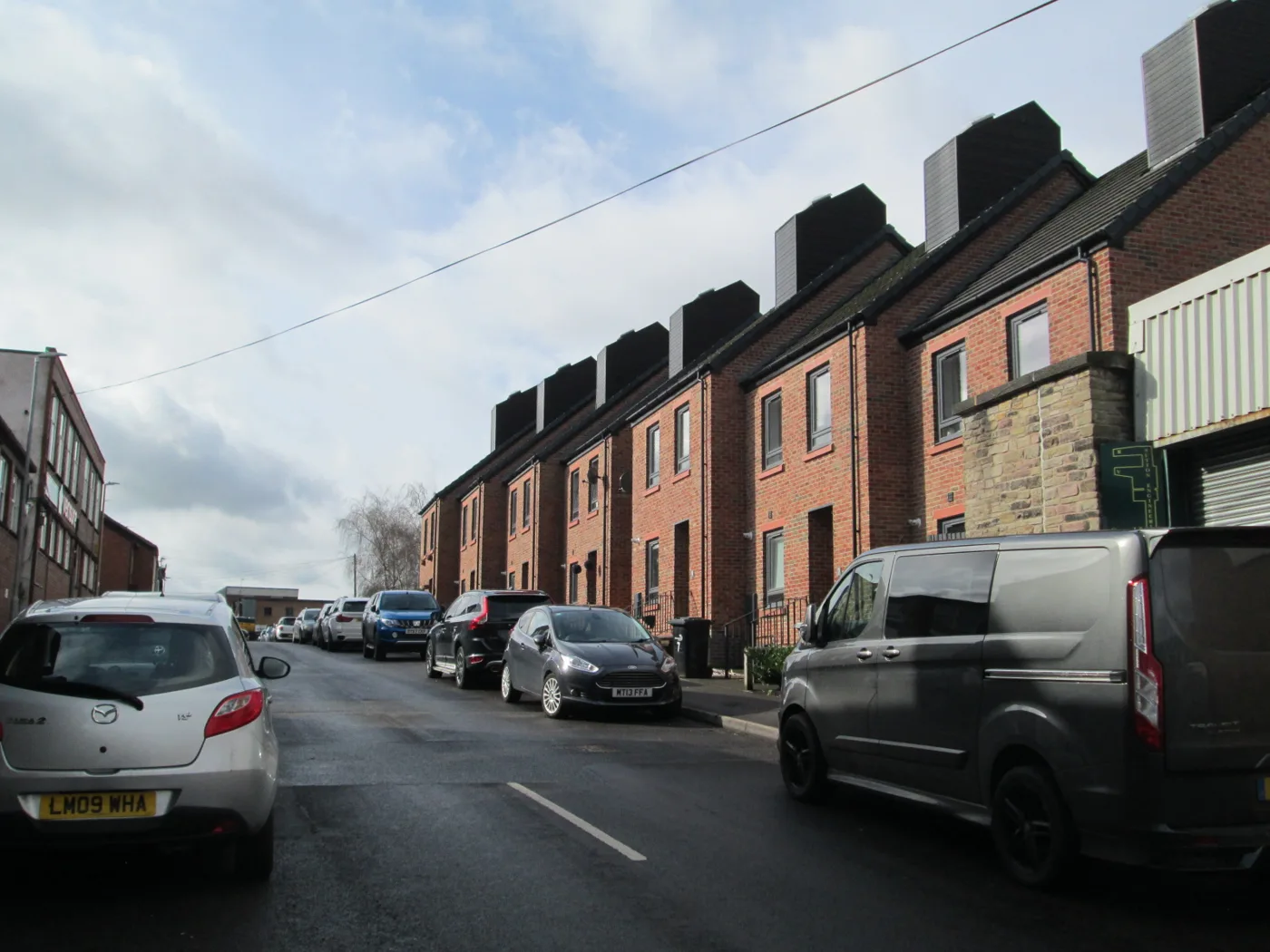 Newer terraced homes on Green Street, Macclesfield. The photo was taken in 2021 and illustrates the town's housing, not any sale in the figures